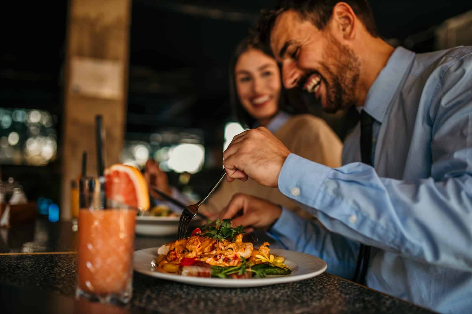 happy couple enjoying at meal at one of the best Bainbridge Island restaurants