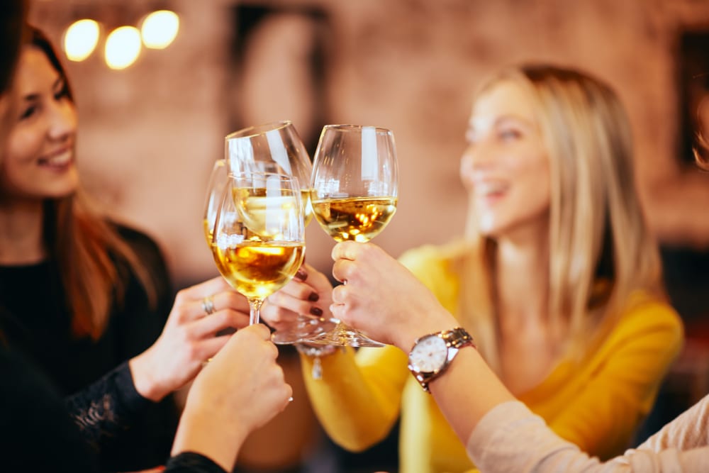 Friends enjoying some delicious bainbridge island wine tasting this summer