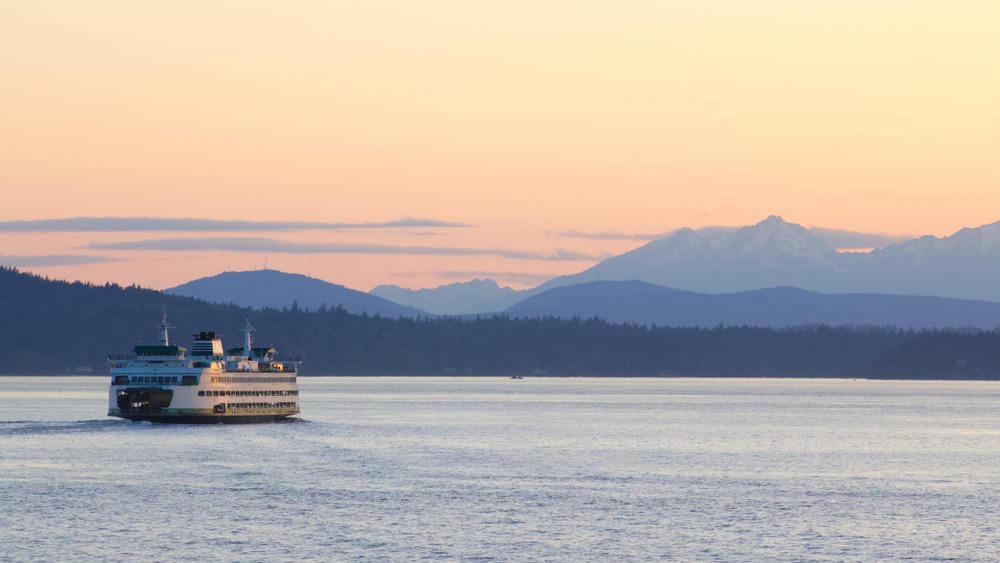 Things to do on Bainbridge Island, photo of the ferry heading to the island in the Puget Sound at sunset 